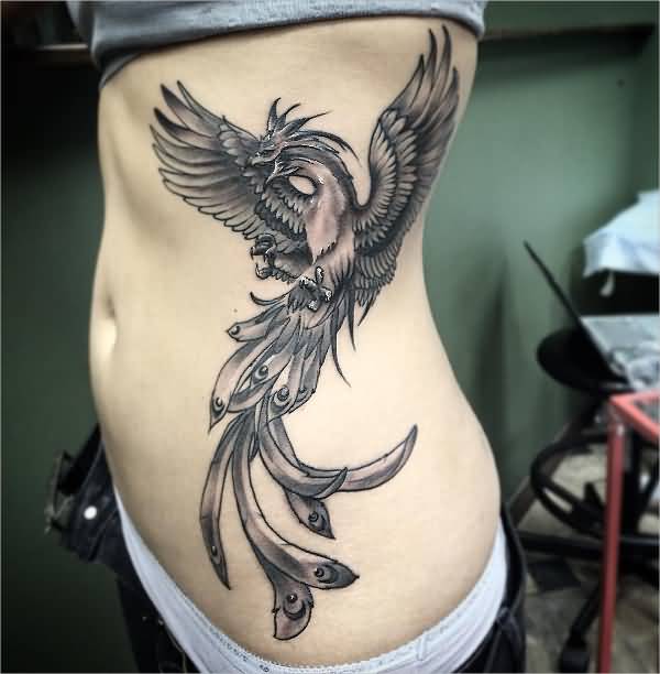 Black And Grey Flying Phoenix Tattoo On Girl Left Side Rib