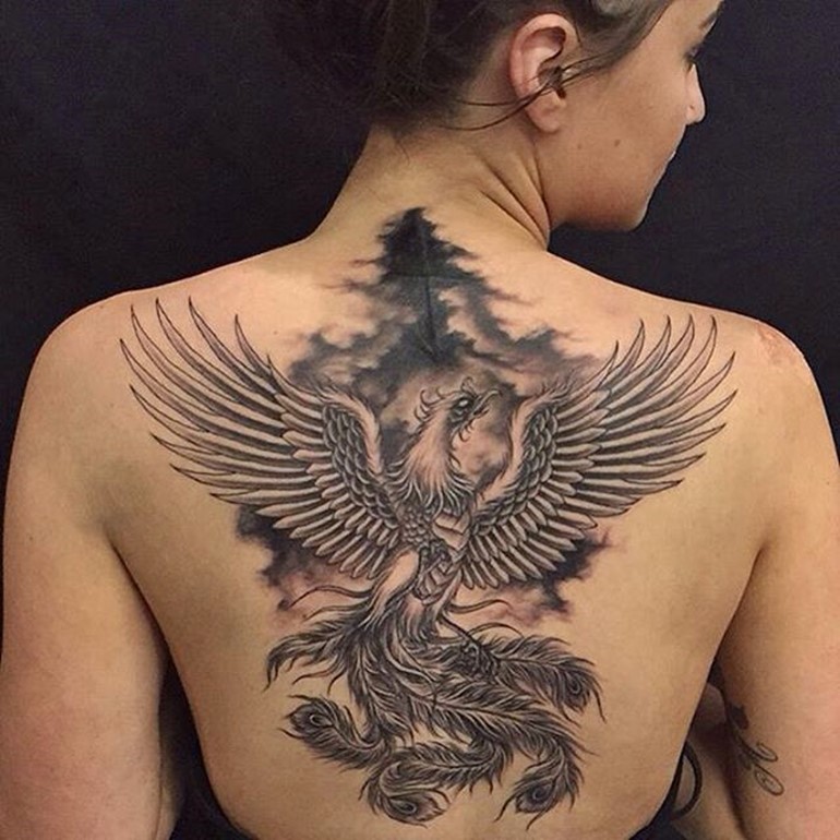 Black And Grey Flying Phoenix Tattoo On Girl Upper Back