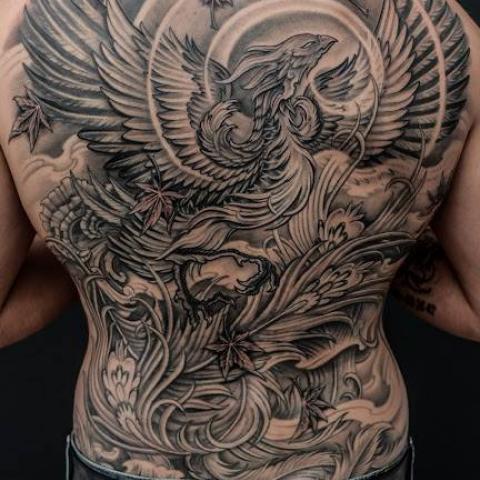 Black And Grey Flying Phoenix Tattoo On Man Full Back