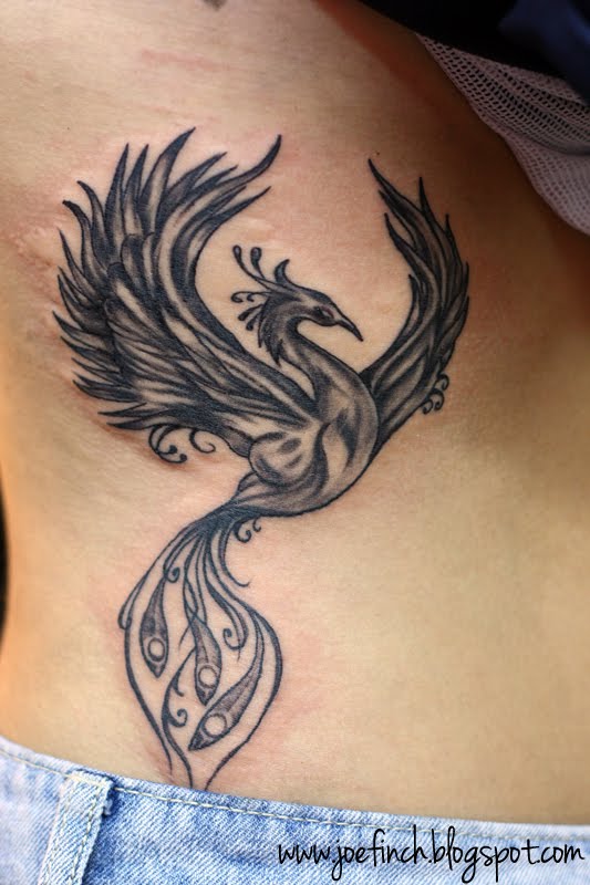 Black And Grey Flying Phoenix Tattoo On Right Side Rib