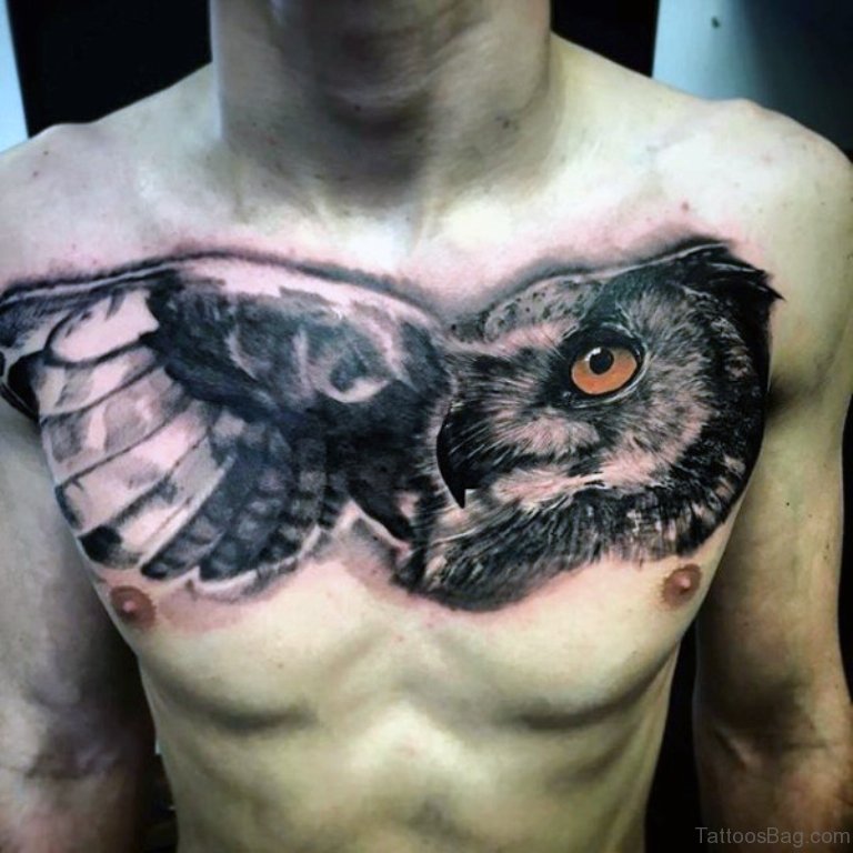 Black And Grey Owl Face Tattoo On Man Chest