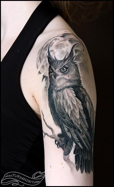 Black And Grey Owl Tattoo On Girl Left Upper Arm