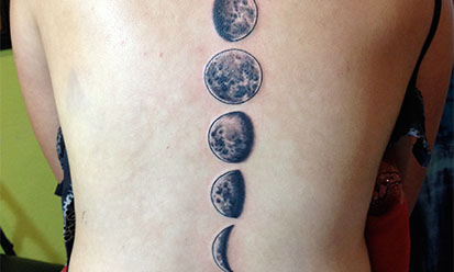 Black And Grey Phases Of The Moon Tattoo On Back