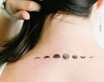 Black And Grey Phases Of The Moon Tattoo On Girl Back Neck