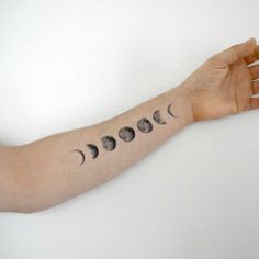 Black And Grey Phases Of The Moon Tattoo On Left Forearm