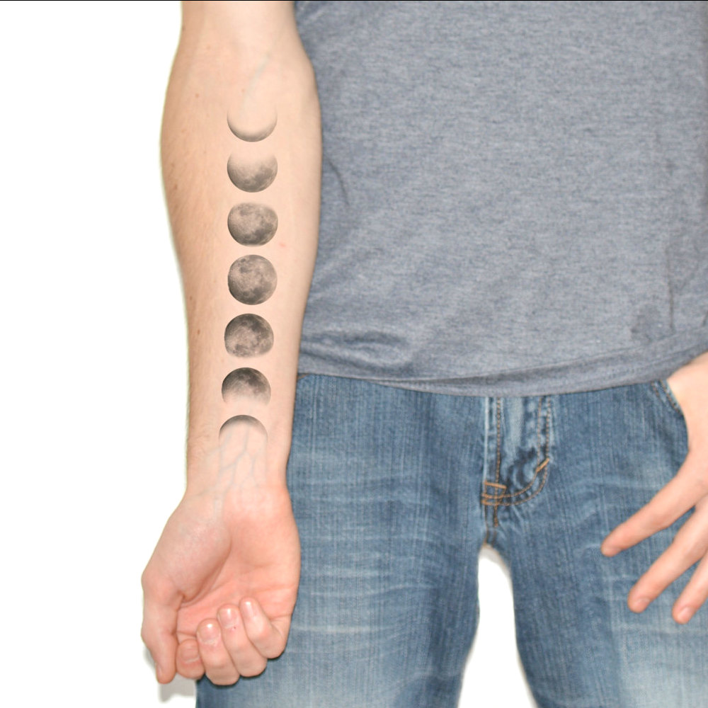 Black And Grey Phases Of The Moon Tattoo On Right Forearm