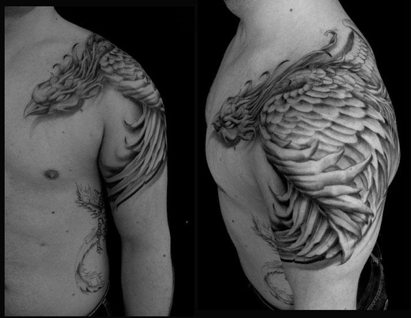 Black And Grey Phoenix Tattoo On Man Left Shoulder