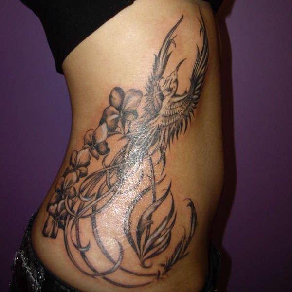 Black And Grey Phoenix Tattoo On Right Side Rib
