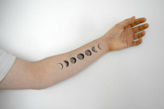Black And Grey Small Phases Of The Moon Tattoo On Left Forearm