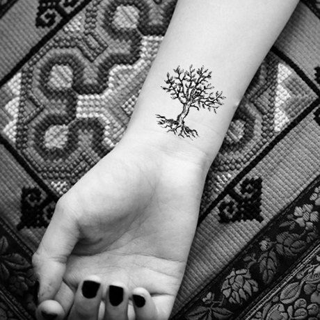 Black And Grey Tree Of Life Tattoo On Girl Right Wrist