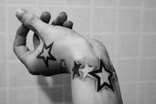 Black And Outline Wrist Star Tattoos