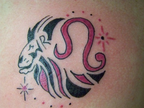 Black And Pink Tribal Leo Zodiac Sign Tattoo Design