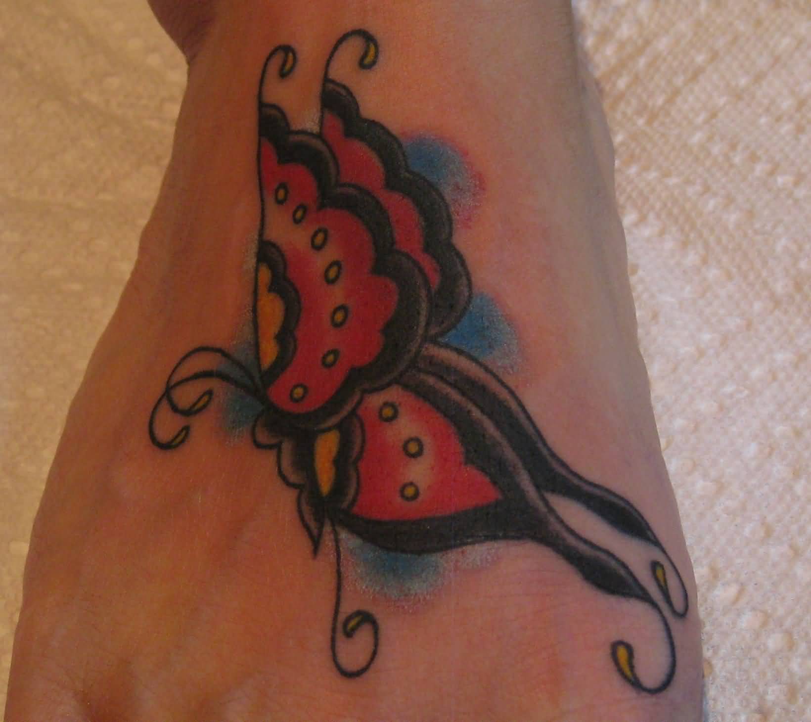 Black And Red Butterfly Foot Tattoo