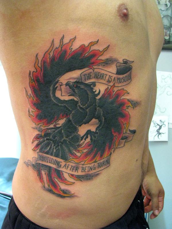Black And Red Phoenix With Banner Tattoo On Man Right Side Rib By JoshDixArt