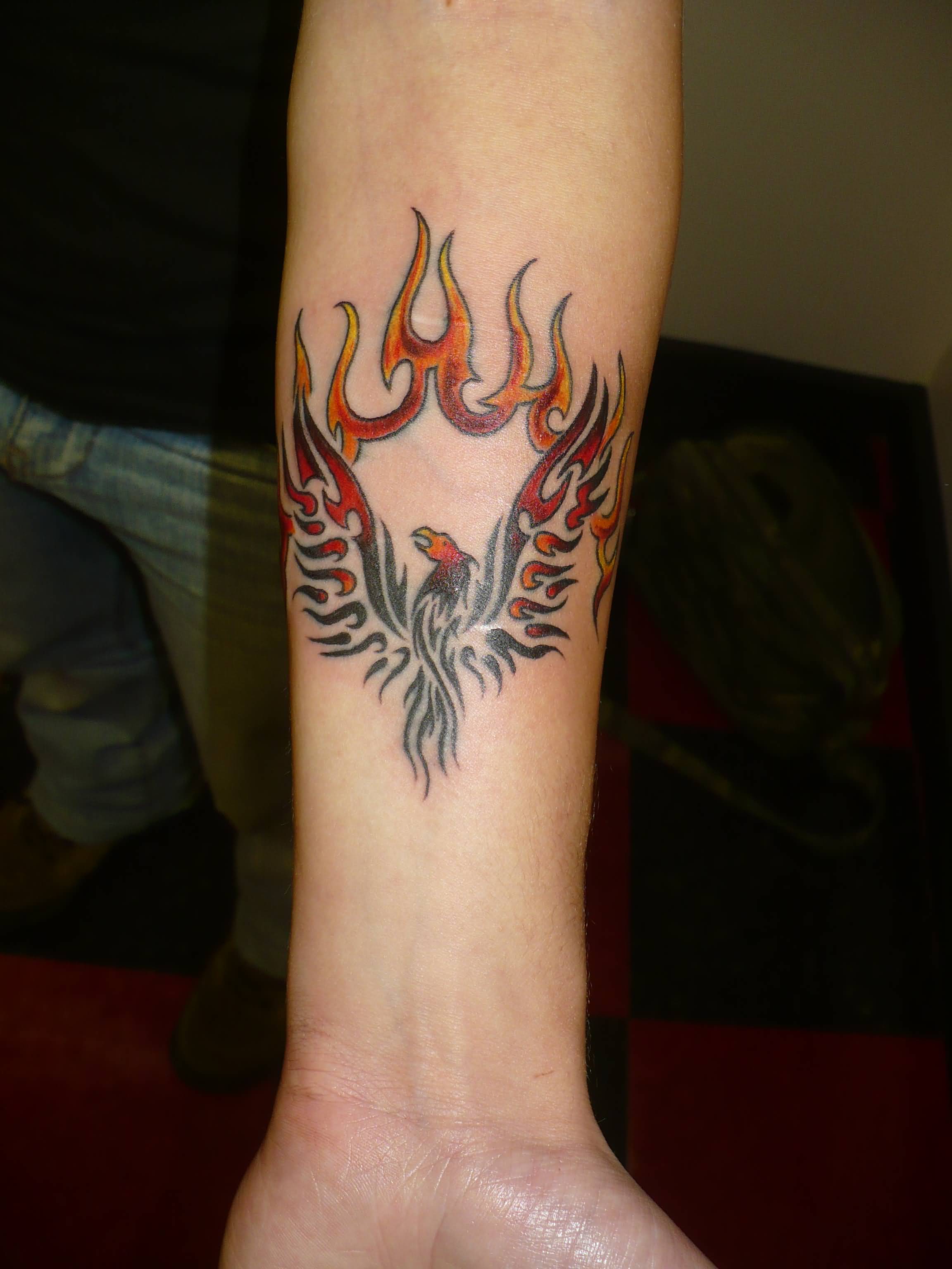 Black And Red Tribal Phoenix Tattoo On Right Forearm
