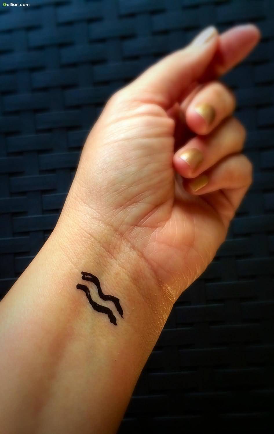 Black Aquarius Zodiac Symbol Tattoo On Left Wrist