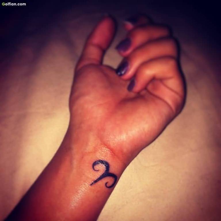 Black Aries Zodiac Sign Tattoo On Girl Left Wrist