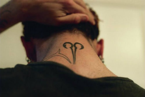 Black Aries Zodiac Sign Tattoo On Man Back Neck