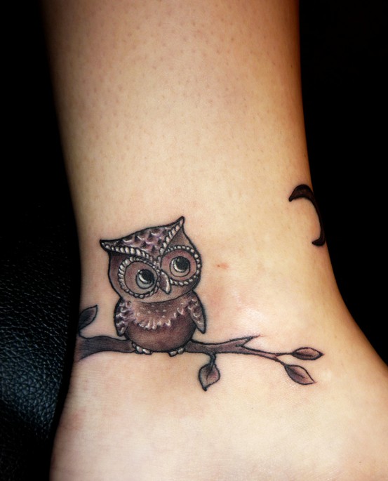 Black Ink Baby Owl On Branch Tattoo Design For Ankle