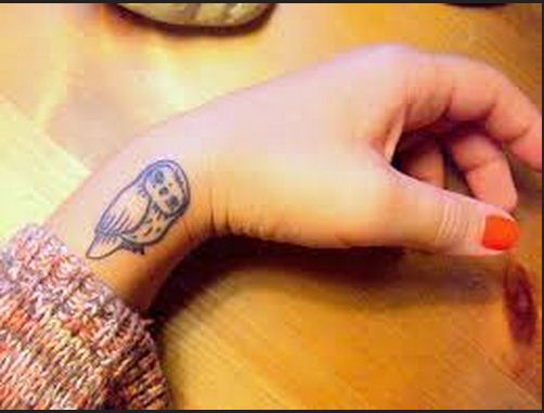 Black Ink Baby Owl Tattoo On Girl Left Side Wrist
