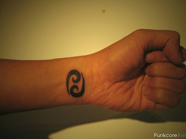 Black Ink Cancer Zodiac Sign Tattoo On Left Wrist