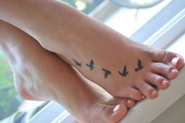 Black Ink Flying Birds Tattoo On Foot