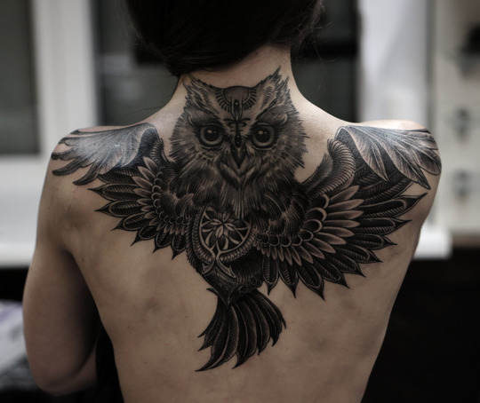 Black Ink Flying Owl Tattoo On Upper Back