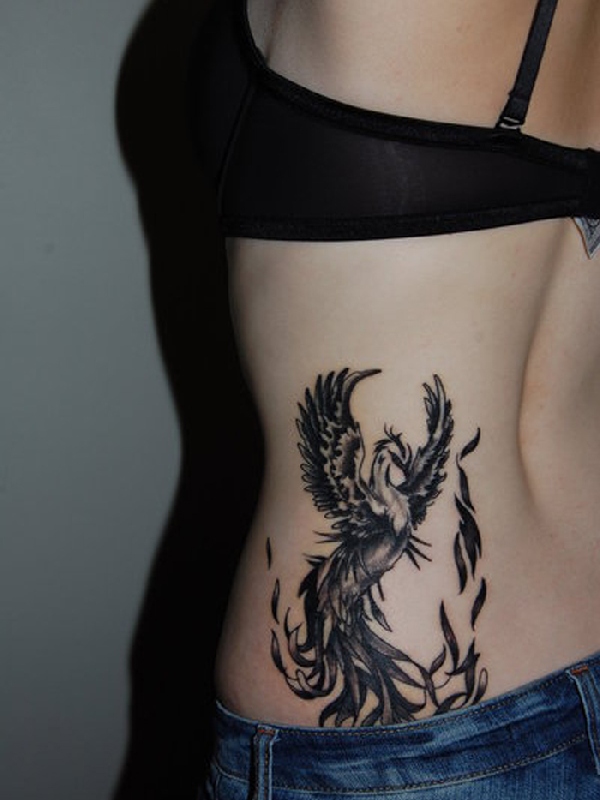 Black Ink Flying Phoenix Bird Tattoo On Girl Left Side Rib