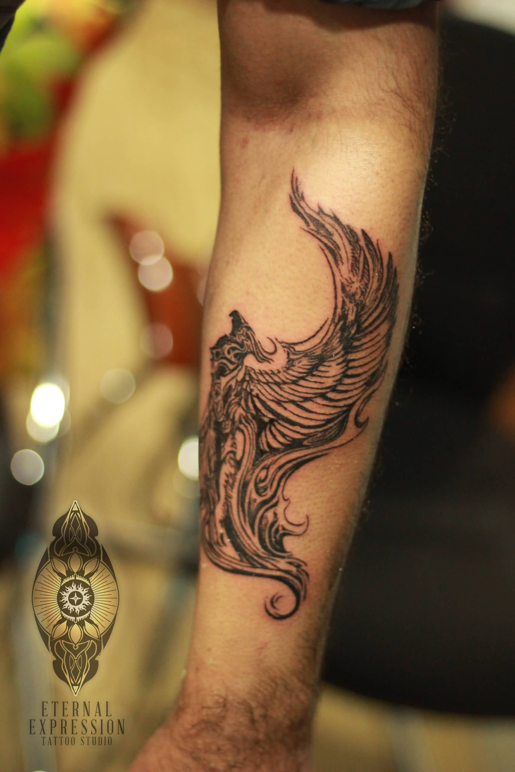 Black Ink Flying Phoenix Tattoo Design For Forearm