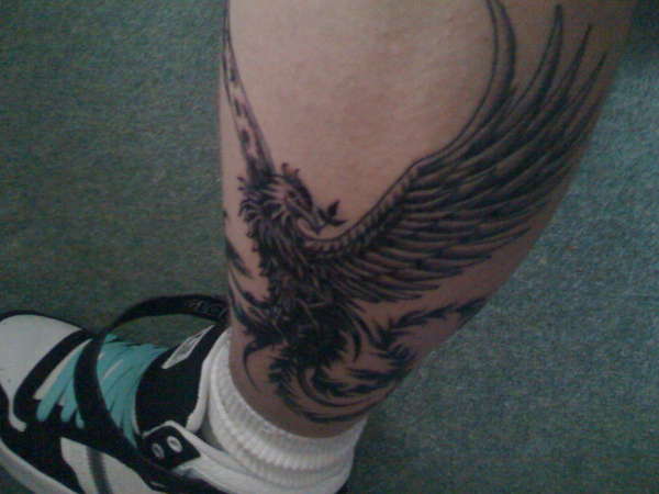 Black Ink Flying Phoenix Tattoo Design For Leg
