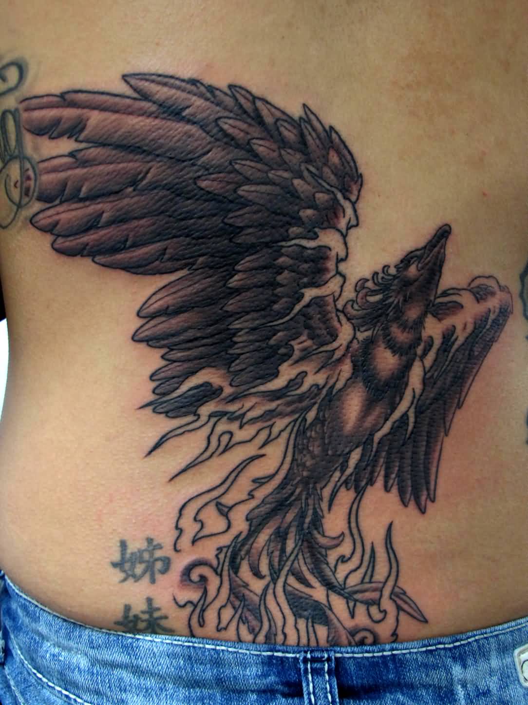 Black Ink Flying Phoenix Tattoo Design For Lower Back