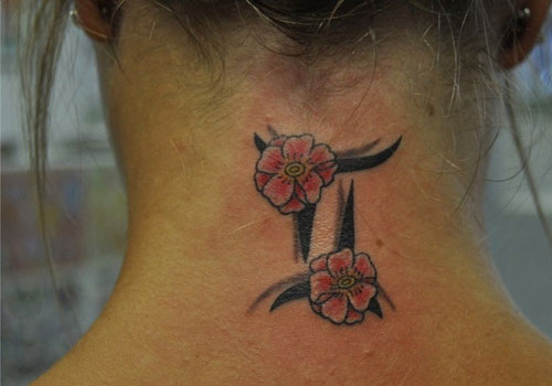 Black Ink Gemini Zodiac Sign With Flowers Tattoo On Girl Back Neck