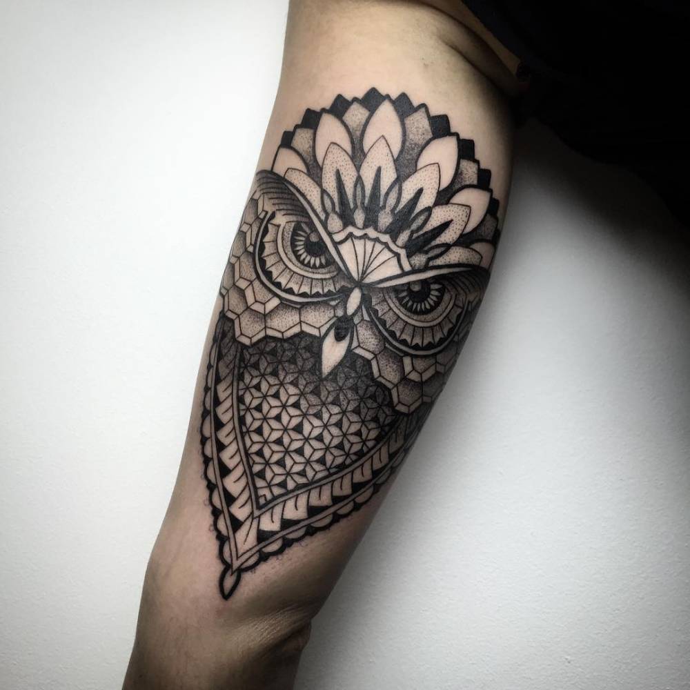 Black Ink Geometric Dotwork Owl Tattoo On Upper Arm