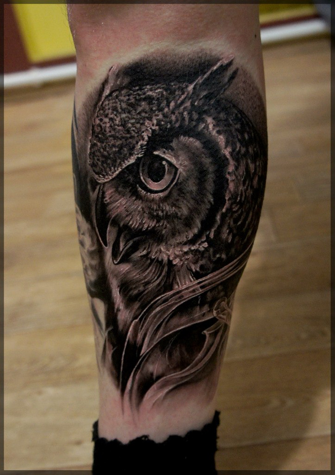 Black Ink Owl Face Tattoo Design For Leg Calf