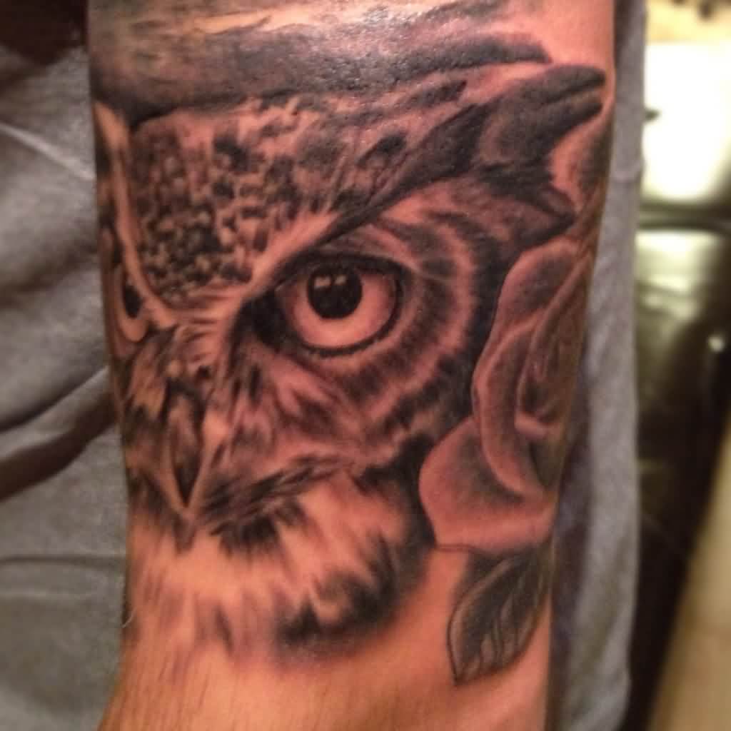Black Ink Owl Face Tattoo Design For Sleeve