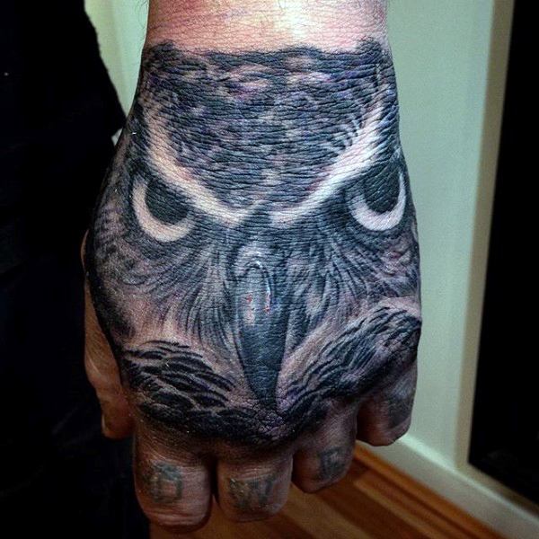 Black Ink Owl Head Tattoo On Man Left Hand