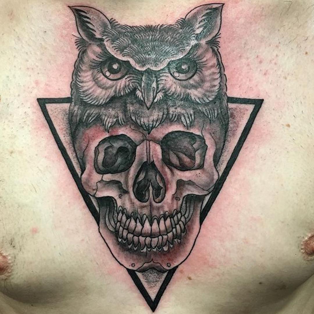 Black Ink Owl Head With Skull Tattoo On Man Chest