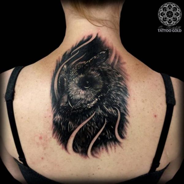 Black Ink Owl Tattoo On Girl Upper Back