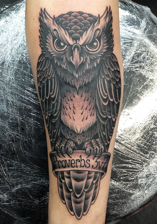 Black Ink Owl With Banner Tattoo Design For Forearm