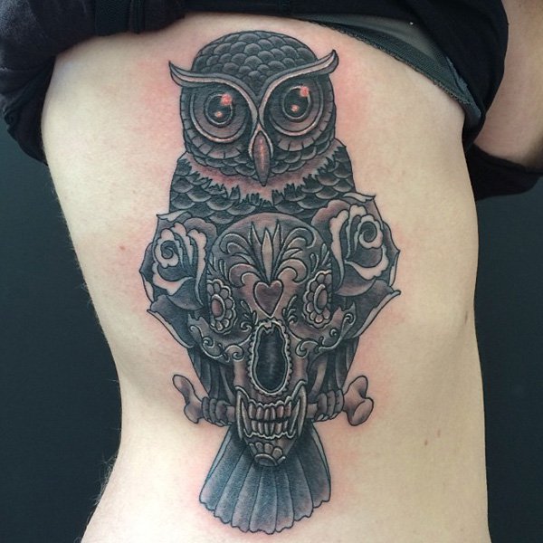 Black Ink Owl With Skull And Roses Tattoo On Girl Right Side Rib