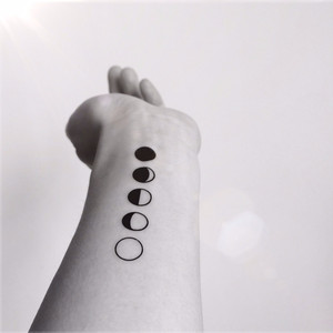 Black Ink Phases Of The Moon Tattoo On Left Wrist