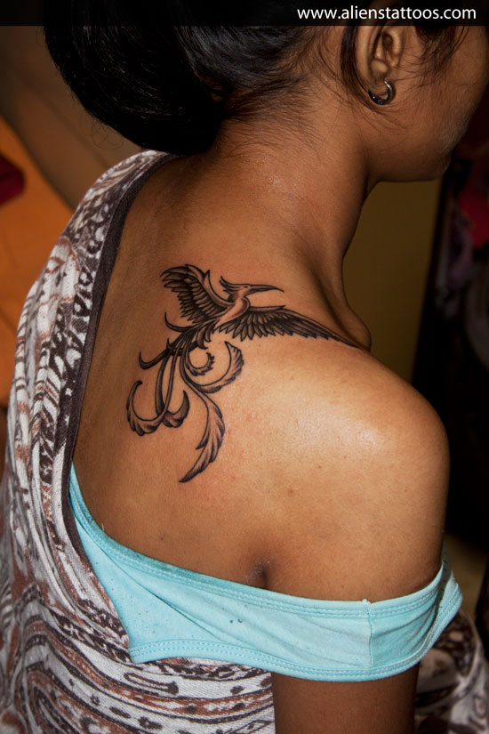 Black Ink Phoenix Tattoo On Girl Right Back Shoulder