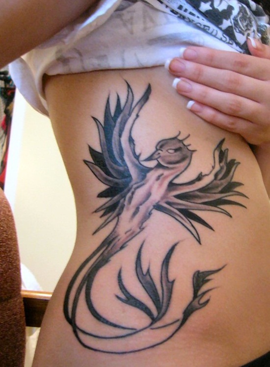 Black Ink Phoenix Tattoo On Girl Right Side Rib