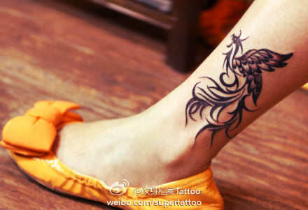 Black Ink Phoenix Tattoo On Left Leg