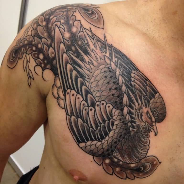 Black Ink Phoenix Tattoo On Man Right Front Shoulder