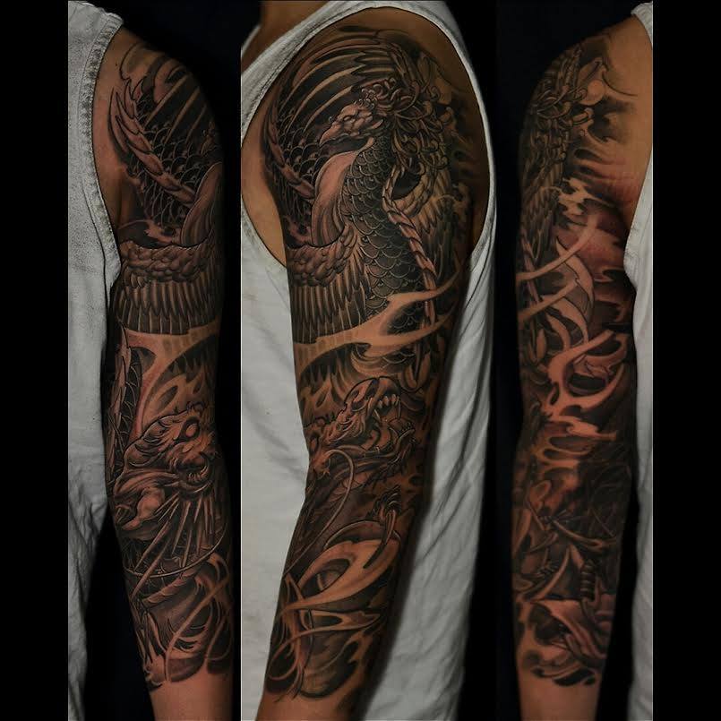 Black Ink Phoenix Tattoo On Man Left Full Sleeve