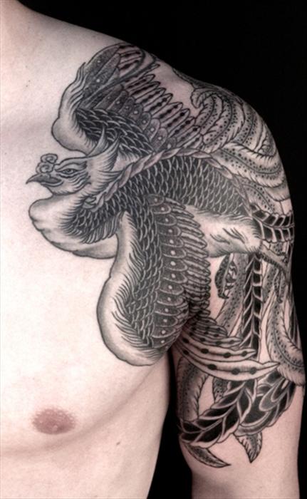 Black Ink Phoenix Tattoo On Man Left Shoulder And Half Sleeve