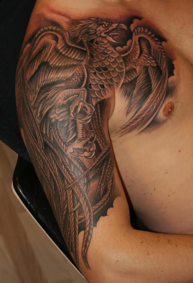 Black Ink Phoenix Tattoo On Man Right Front Shoulder And Half Sleeve
