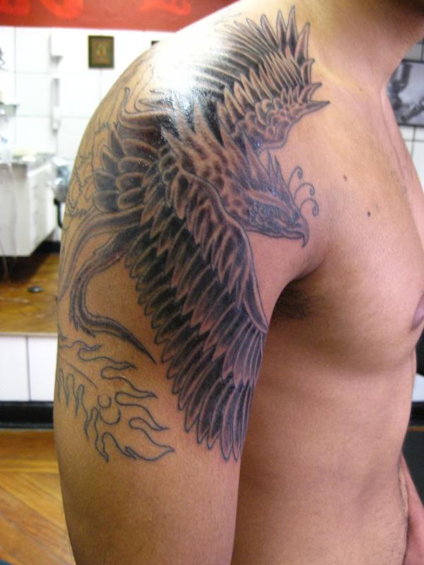 Black Ink Phoenix Tattoo On Man Right Shoulder