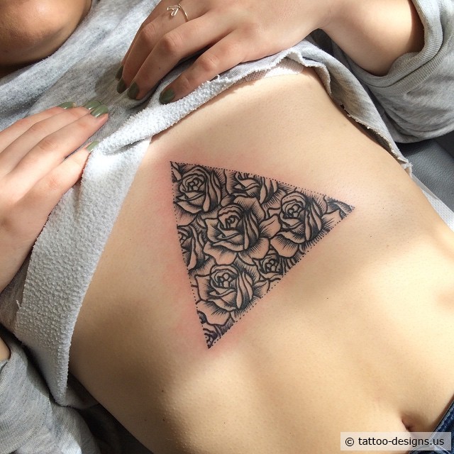 Black Ink Roses In Triangle Tattoo On Girl Under Chest